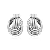 Pair of silver knot earrings on a white background