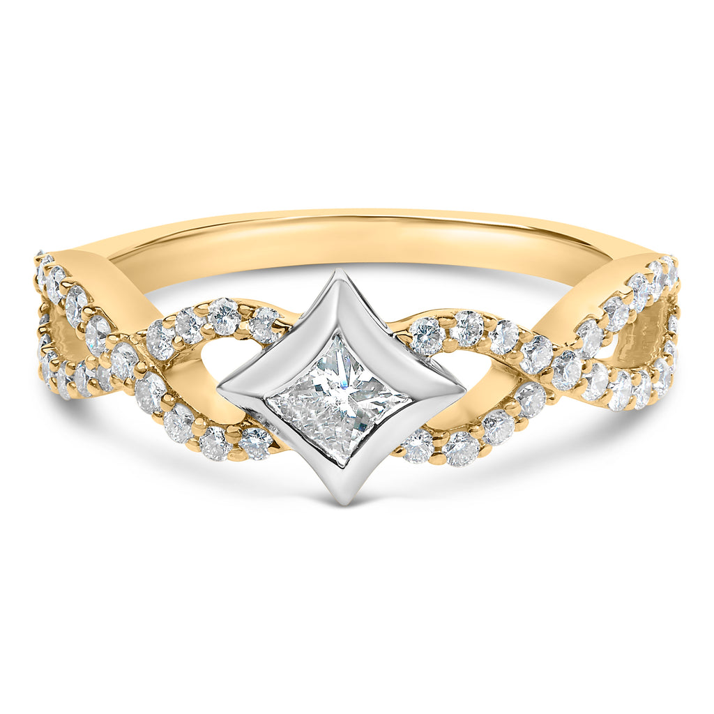 Gold and silver ring with diamond accents on a white background
