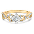 Gold and silver ring with diamond accents on a white background