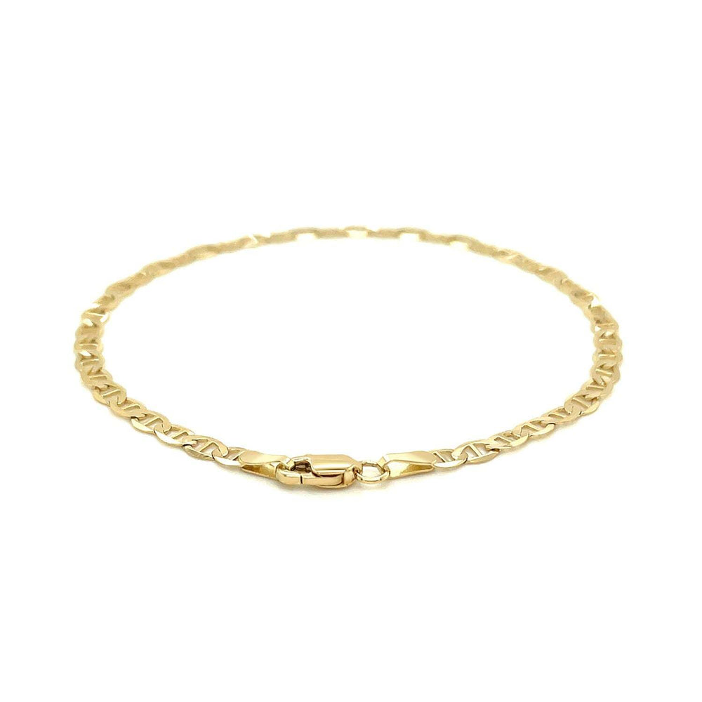 Gold chain bracelet on a white background