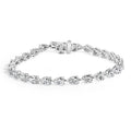 Silver bracelet with clear gemstones on a white background