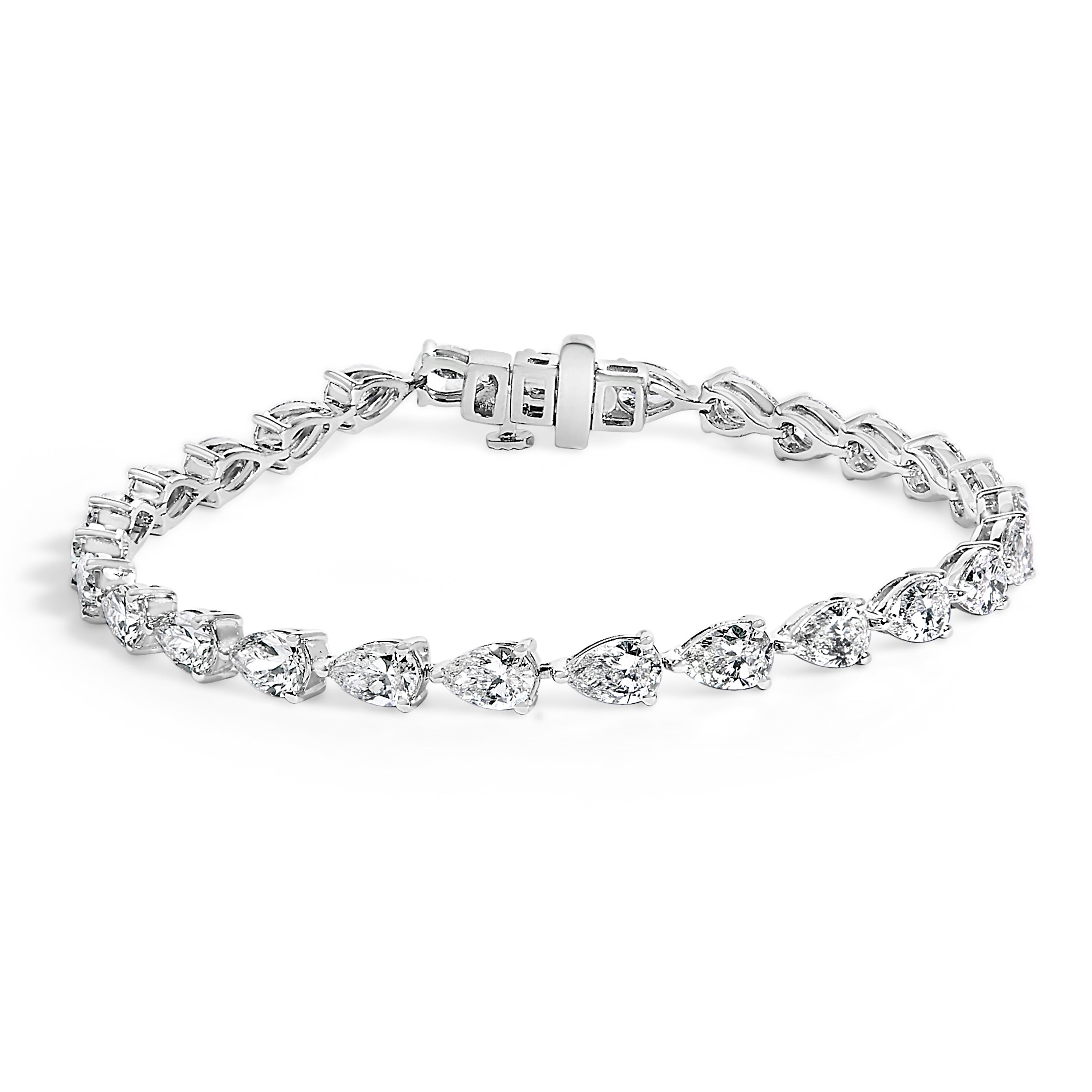 Silver bracelet with clear gemstones on a white background