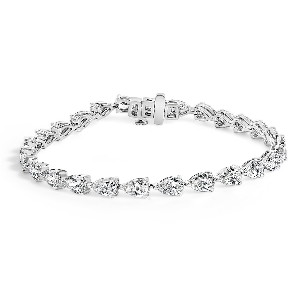 Silver bracelet with clear gemstones on a white background