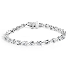 Silver bracelet with clear gemstones on a white background
