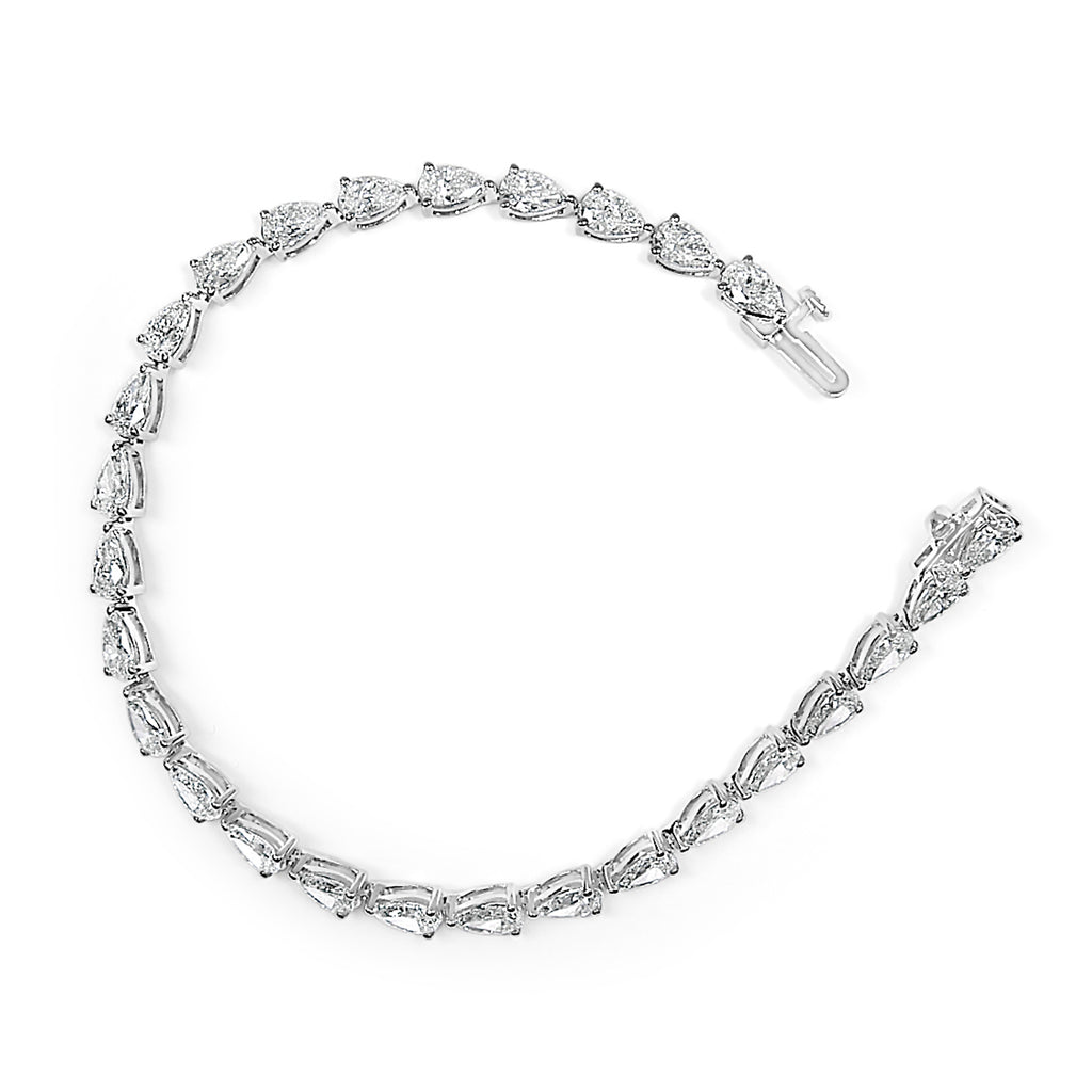 Silver bracelet with clear gemstones on a white background