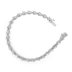 Silver bracelet with clear gemstones on a white background