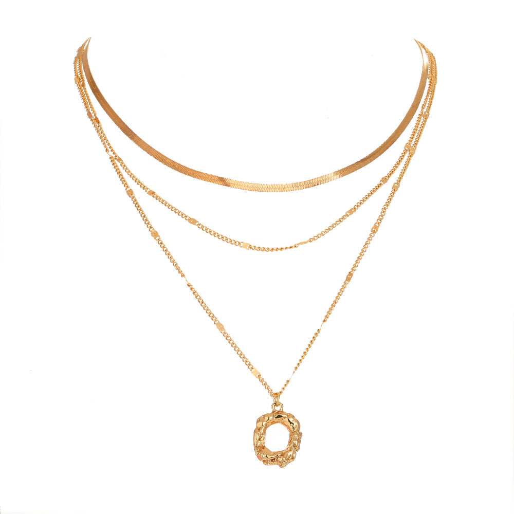 Two gold necklaces on a white background