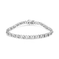 Silver bracelet with clear stones on a white background