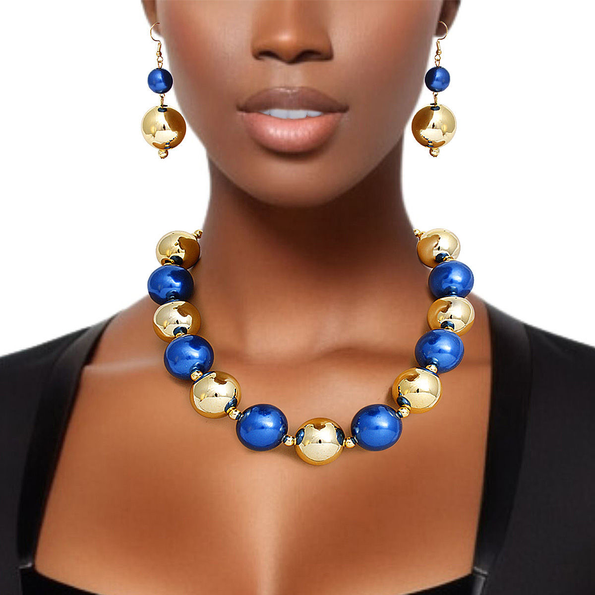 Necklace with blue and gold beads on a mannequin against a white background