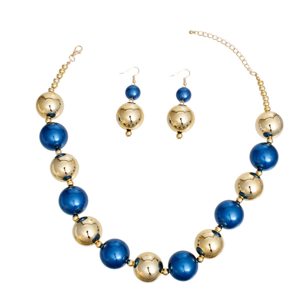 Necklace and earrings set with blue and gold beads on a white background