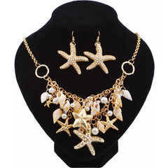 Jewelry set with necklace and earrings on a black stand