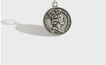 Silver pendant with a portrait on a white background