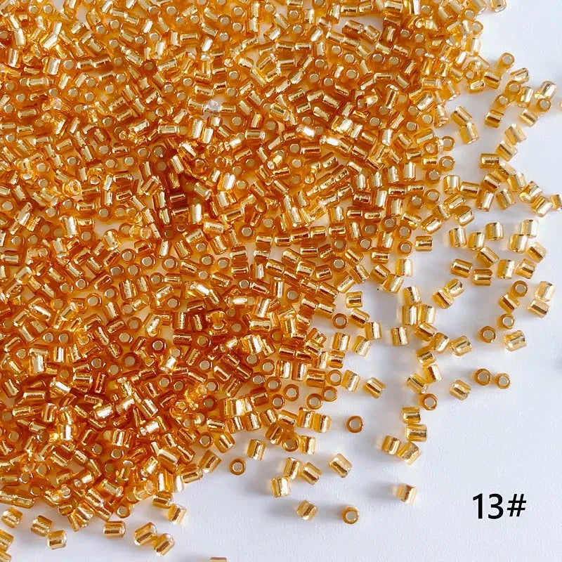 Gold-colored beads scattered on a white background with '13#' label.