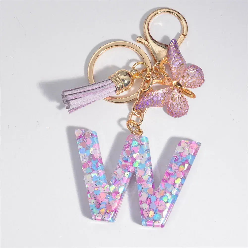 Color: Dark Brown - Fashion Tassel Butterfly 26Letter Keychain Colorful Love Heart Filled Resin Alphabet Keyring Women Girls Car Bag Phone Pendant