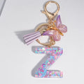 Color: Dark Brown - Fashion Tassel Butterfly 26Letter Keychain Colorful Love Heart Filled Resin Alphabet Keyring Women Girls Car Bag Phone Pendant