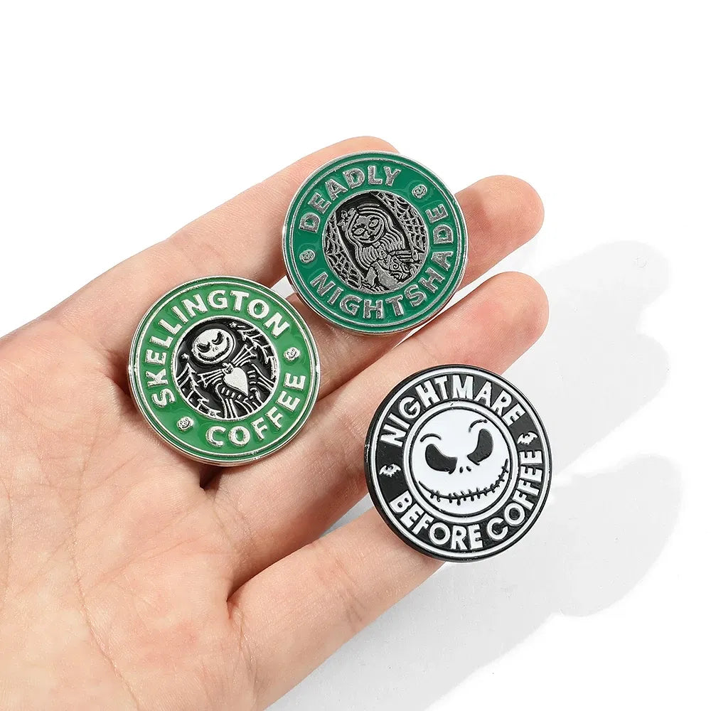Three circular pins with 'Skellington Coffee' and 'Nightmare Before Coffee' designs held in a hand.