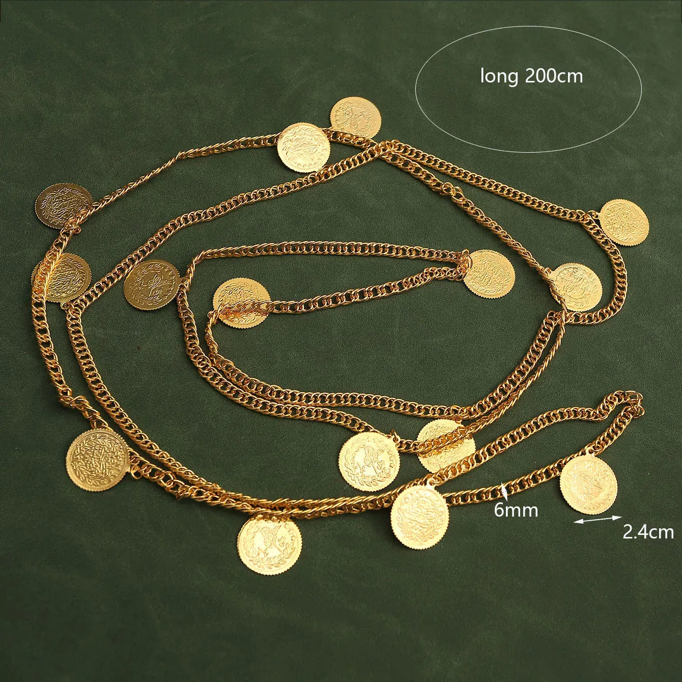 Gold chain with circular pendants on a green background